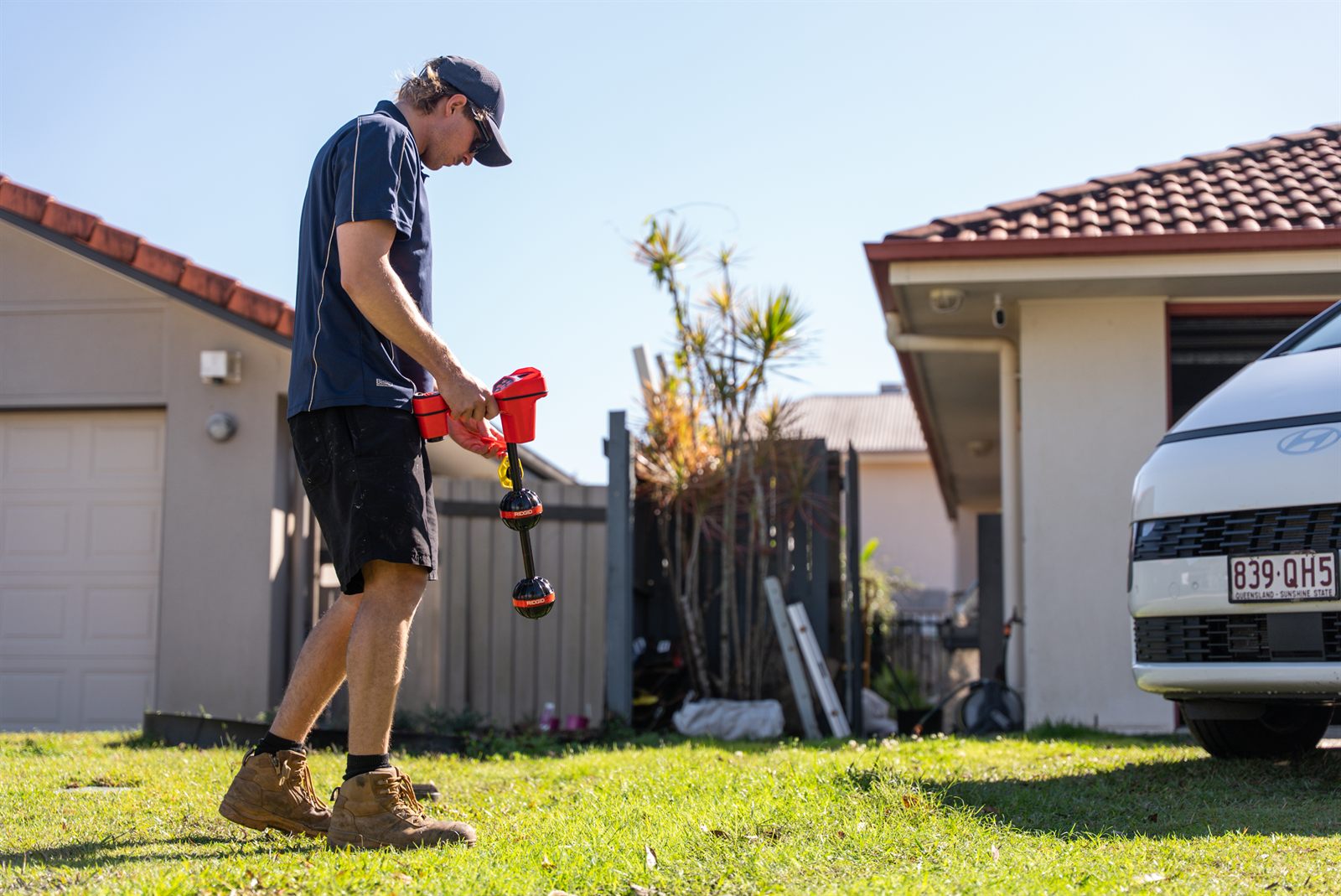 Elements Plumbing using a drain locator to pinpoint an underground pipe